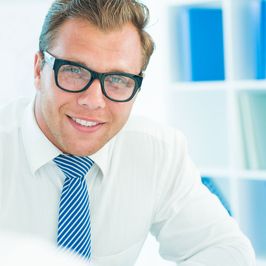 A smiling business man in shirt and tie